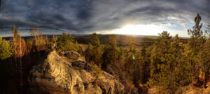 Side lighting revealing texture and depth across mountain ridges during sunrise.